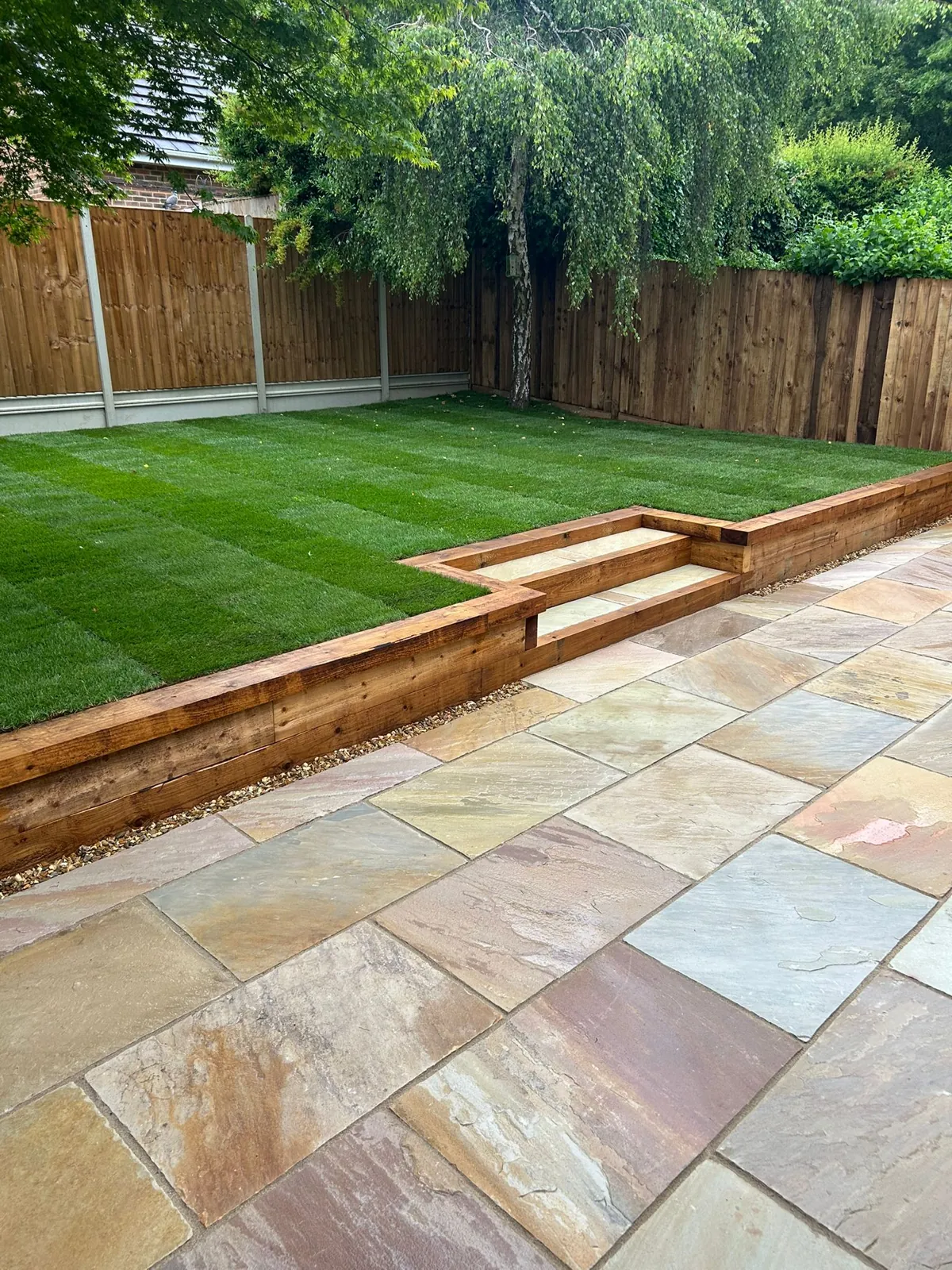 Sandstone sleeper retaining wall built by Spruce Brothers in Aldershot, Hampshire